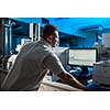 Senior male researcher carrying out scientific research in a lab (shallow DOF; color toned image)
