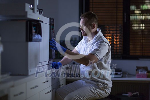 Senior male researcher carrying out scientific research in a lab (shallow DOF; color toned image) Senior male researcher carrying out scientific research in a lab (shallow DOF; color toned image)