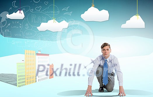 Young determined businessman in starting position ready to compete Young determined businessman in starting position ready to compete
