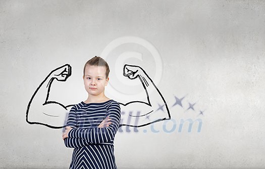 Cute kid girl with arms crossed on chest and drawn muscular hands Cute kid girl with arms crossed on chest and drawn muscular hands
