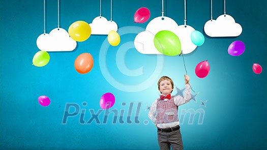 Little boy wearing red bowtie holding colorful balloon Little boy wearing red bowtie holding colorful balloon