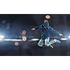 Modern style male dancer jumping in lights of spotlight