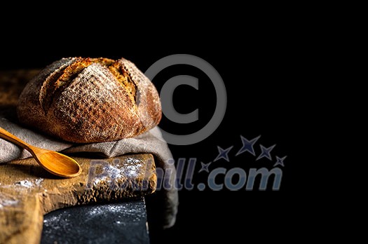 Fresh homemade bread on dark table. Rustic style. Fresh homemade bread on dark table. Rustic style.