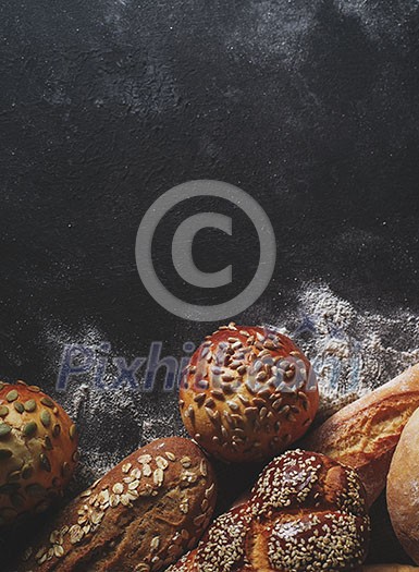 Assortment of fresh bread on the table. Copyspace for text. Assortment of fresh bread on the table. Copyspace for text.