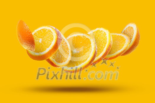 flying pieces of a slice of ripe orange isolated on an orange background flying pieces of a slice of ripe orange isolated on an orange background