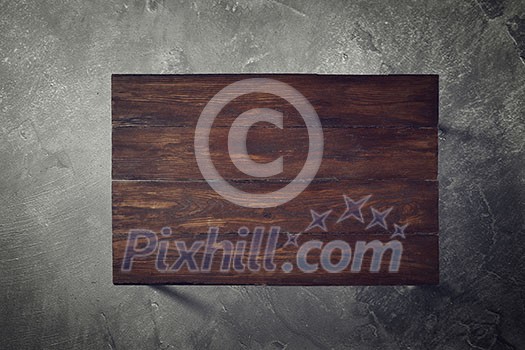 brown wooden table on a concrete background top view flat lay