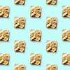 sandwiches with banana on blue background, pattern flat lay