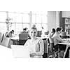Young female Entrepreneur Freelancer Working Using A Laptop In Coworking space