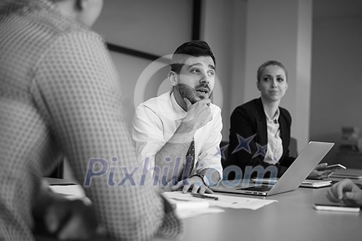 business people group on meeting at modern startup office, senior man as leader looking on tablet and laptop presentation of his team business people group on meeting at modern startup office, senior man as leader looking on tablet and laptop presentation of his team
