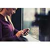 business woman at office using smart phone to check internet and type messages