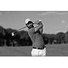 golf player shot ball from sand bunker at course