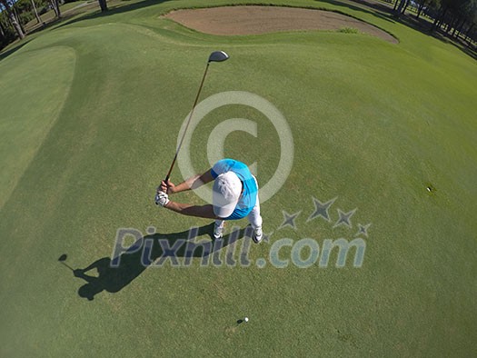 top view of golf player hitting shot with club on course at beautiful morning top view of golf player hitting shot with club on course at beautiful morning