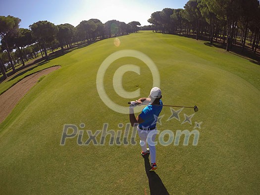 top view of golf player hitting shot with club on course at beautiful morning top view of golf player hitting shot with club on course at beautiful morning