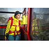 Pretty, young female hiker walking in high mountains (shallow DOF) - female hiker riding in a cable car admiring the alpine views