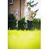 Senior woman doing some gardening in her lovely garden