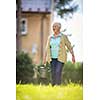 Senior woman doing some gardening in her lovely garden