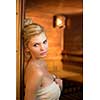 Attractive young woman relaxing in a sauna