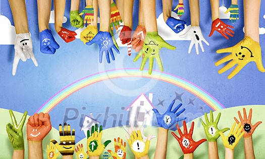 Human hands in colorful paint showing symbols Human hands in colorful paint showing symbols