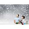 Two cute children at chemistry lesson making experiments