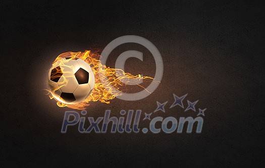 Conceptual image of football ball in fire flames Conceptual image of football ball in fire flames