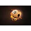 Conceptual image of football ball in fire flames