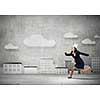 Young businesswoman in paper crown running in a hurry