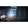 Businessman using tablet over virtual interface background