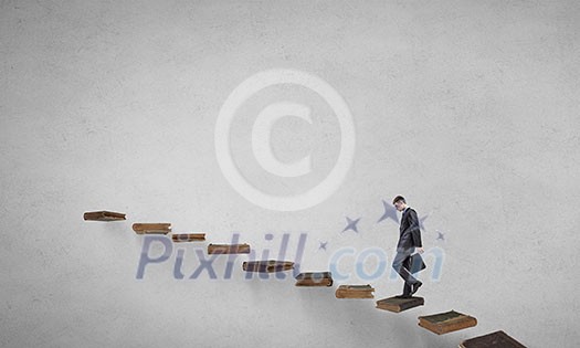 Businessman walking on career ladder made of books Businessman walking on career ladder made of books