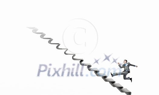 Young businessman running up on staircase representing success concept Young businessman running up on staircase representing success concept