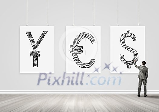 Businessman standing with back and writing yes word on banner Businessman standing with back and writing yes word on banner