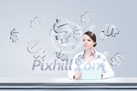 Attractive businesswoman sitting at table and using tablet Attractive businesswoman sitting at table and using tablet