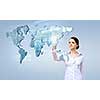 Attractive businesswoman touching map on media screen with finger