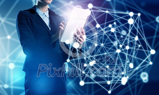 Businesswoman with tablet pc against high tech background Businesswoman with tablet pc against high tech background