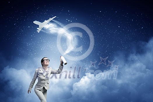 Young woman in suit and glasses spraying airplane in sky Young woman in suit and glasses spraying airplane in sky
