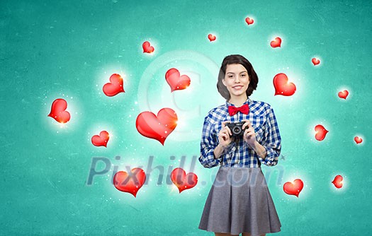 Young beautiful woman taking photo with retro camera Young beautiful woman taking photo with retro camera