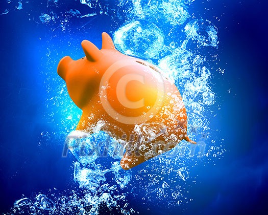 Piggy bank sink in clear blue water Piggy bank sink in clear blue water