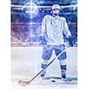 young ice hockey player portrait on training in black background