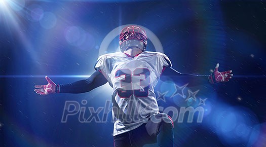 american football player celebrating after scoring a touchdown on the field of big modern stadium with lights and flares at night american football player celebrating after scoring a touchdown on the field of big modern stadium with lights and flares at night