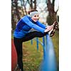 Young woman stretching before her run