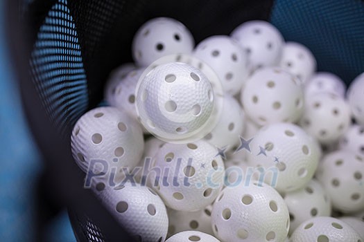 Floorball balls in a basket ready for training Floorball balls in a basket ready for training
