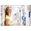 Pretty, female student in a library