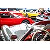 Old cars auction - People viewing cars on sale during an expensive old cars  auction