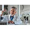 Senior chemistry professor/doctor in a lab (color toned image)