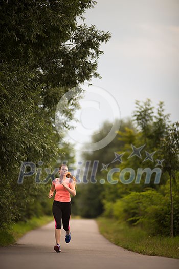 Young woman running outdoors on a lovely sunny winter/fall day Young woman running outdoors on a lovely sunny winter/fall day