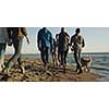 Group Of Young Friends Spending The Day On A Beach during autumn day