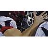 American Football Players having fun and knocking each other with helmet