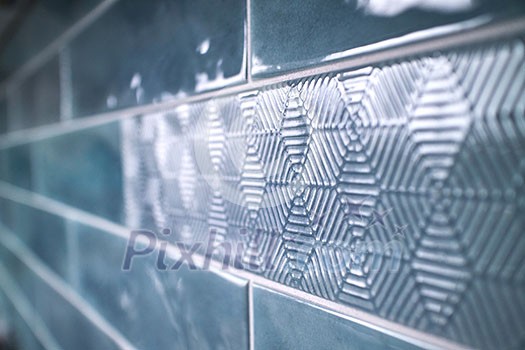 Close-up of a glossy ceramic blue tile with a pattern. Can used for background or design Close-up of a glossy ceramic blue tile with a pattern. Can used for background or design