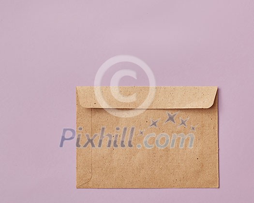 Brown envelopes cardboard sheet of recycle paper gift cards and invitations or business concept with copy space isolated on pink background. Flat lay Brown envelopes cardboard sheet of recycle paper gift cards and invitations or business concept with copy space isolated on pink background. Flat lay