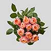 Creative pink bouquet of rose with green leaves on gray background as a concept of a holiday greeting card for Mother's Day or March 8 . Flat lay composition.