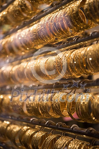 Fashion jewelry from yellow and white gold, on a window shop Fashion jewelry from yellow and white gold, on a window shop